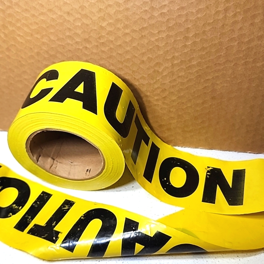CAUTION roll of Tape. 3 inches wide.Bright yellow and black